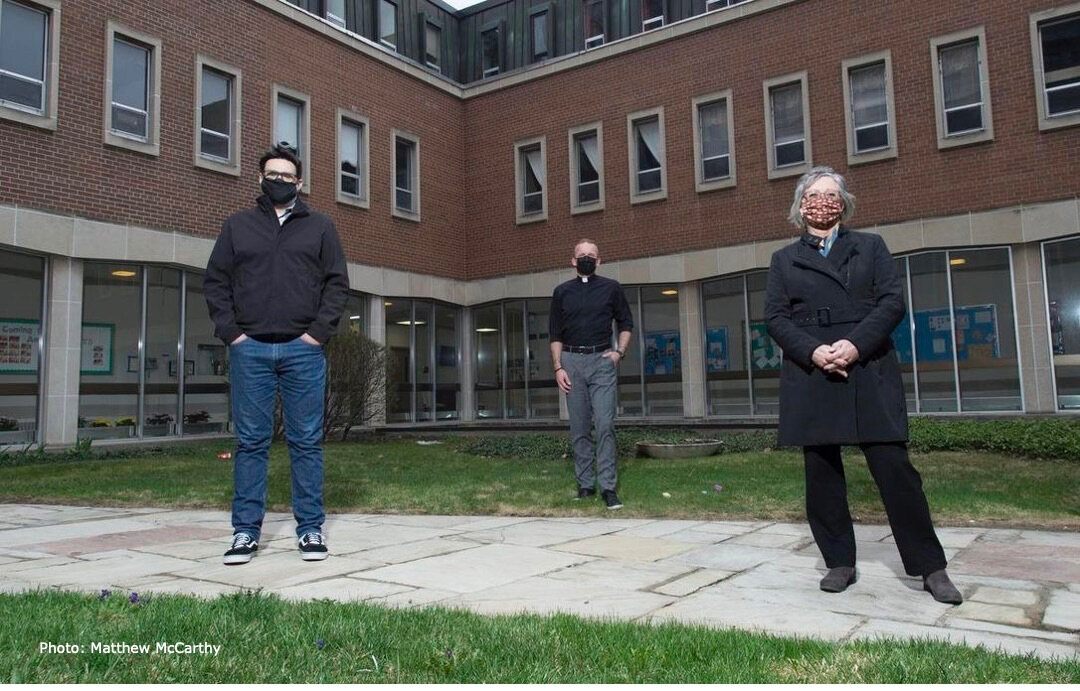 three people standing in the courtyard of St. Peter's